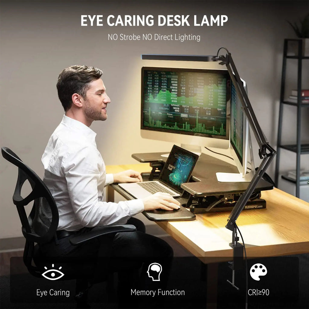 Man at modern workstation using eye caring LED clamp desk lamp, focus on lamp features
