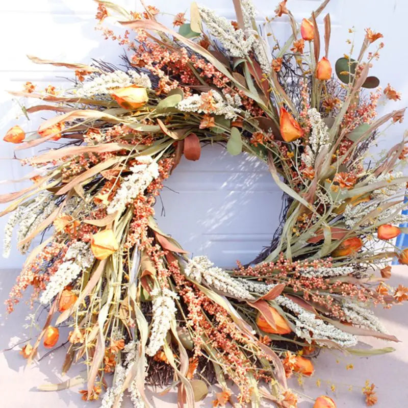 Detail view of the full artificial autumn wreath showing wheat ears and orange accents