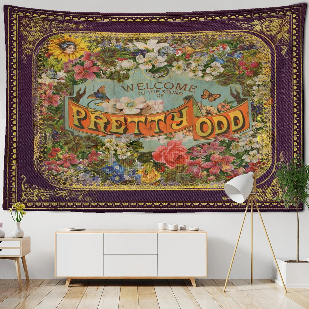 Floral illustration tapestry used as a statement wall in a bright living room