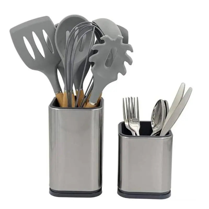 Two stainless steel kitchen utensil holders on a countertop, one filled with spatulas and one with cutlery