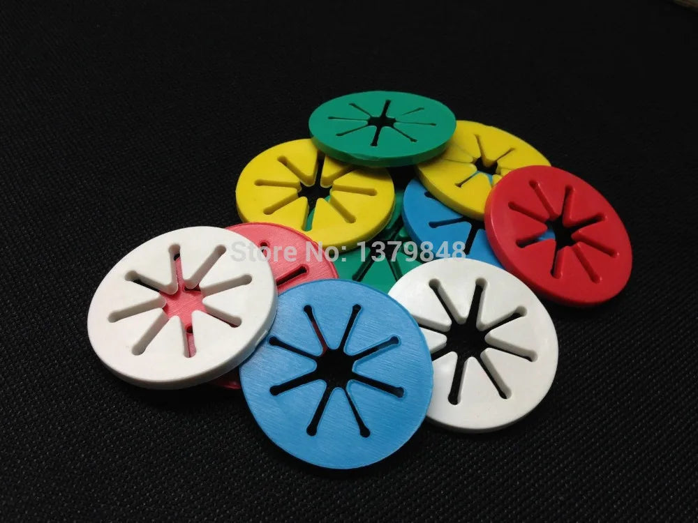 Scattered blue, green, yellow, red, and white plastic sock organizer rings