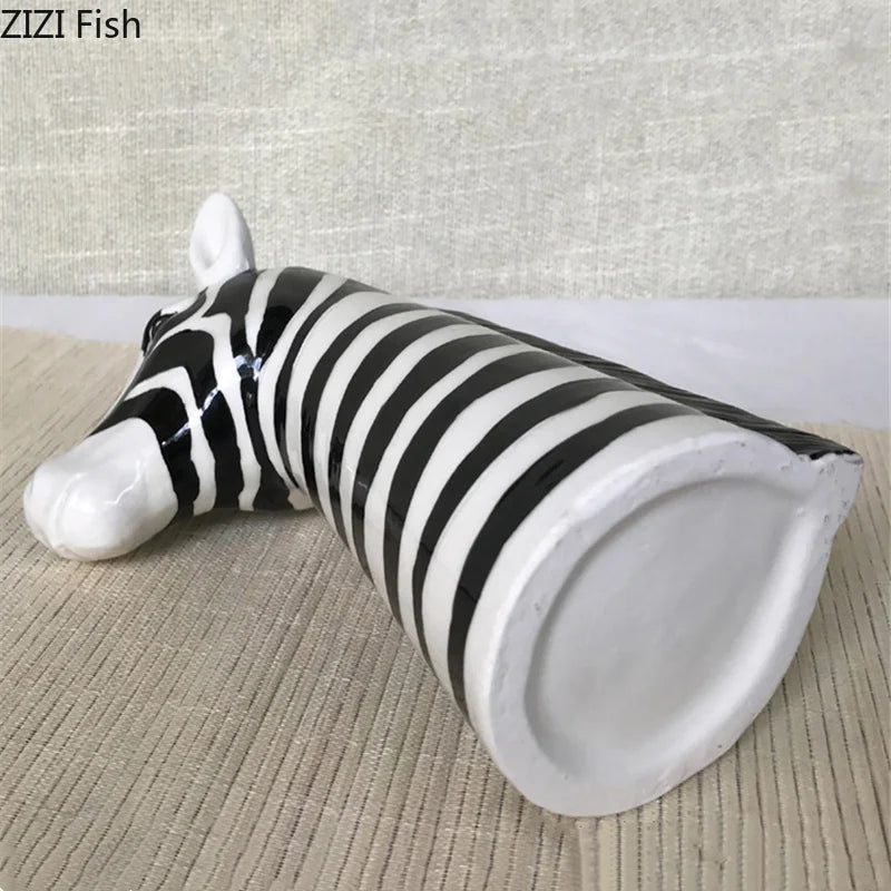 Bottom view of black and white ceramic zebra head vase