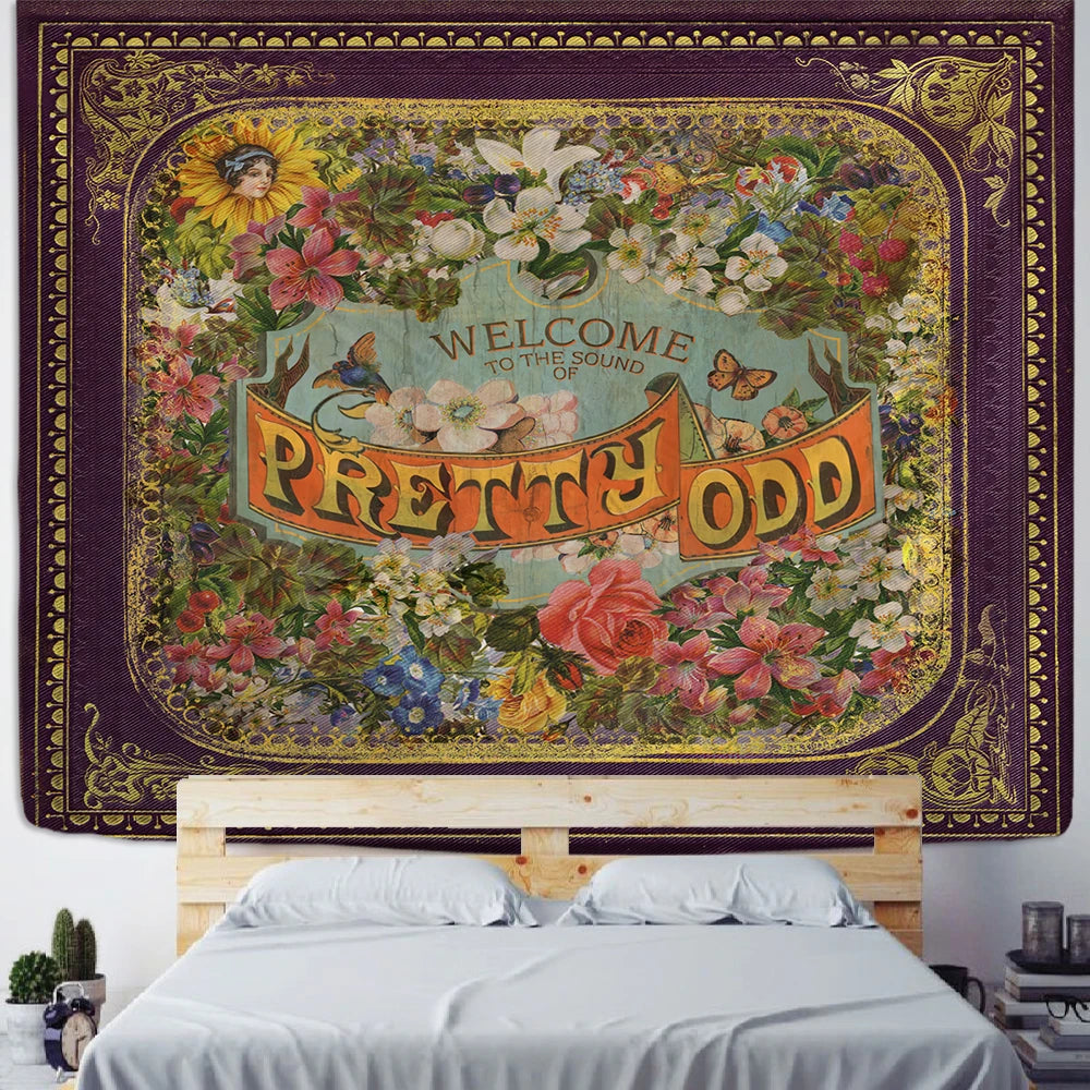 Retro floral tapestry wall hanging with the phrase 'Pretty Odd' above a bed