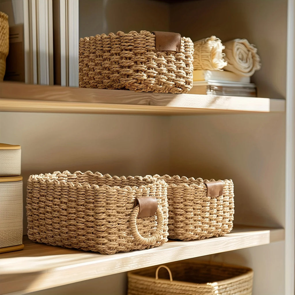 Two woven baskets on open shelving used to organize linens and books