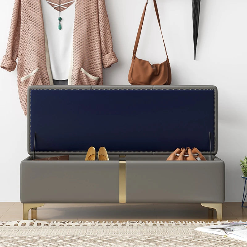 Open storage ottoman bench showing shoes organized inside in a hallway