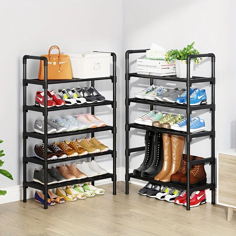 Two black five-tier shoe racks filled with assorted shoes, boots, and bags in a bright corner