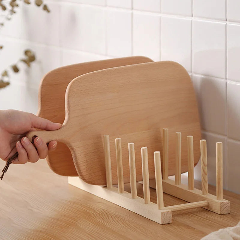 Wooden plate rack holding two cutting boards on a countertop