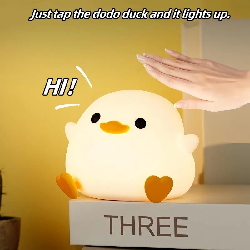 Hand tapping duck night light to activate touch control