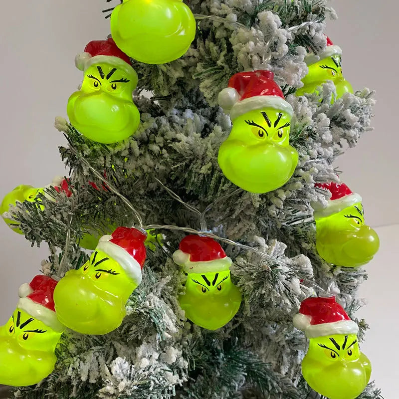 Grinch Christmas string lights displayed on a decorated tree