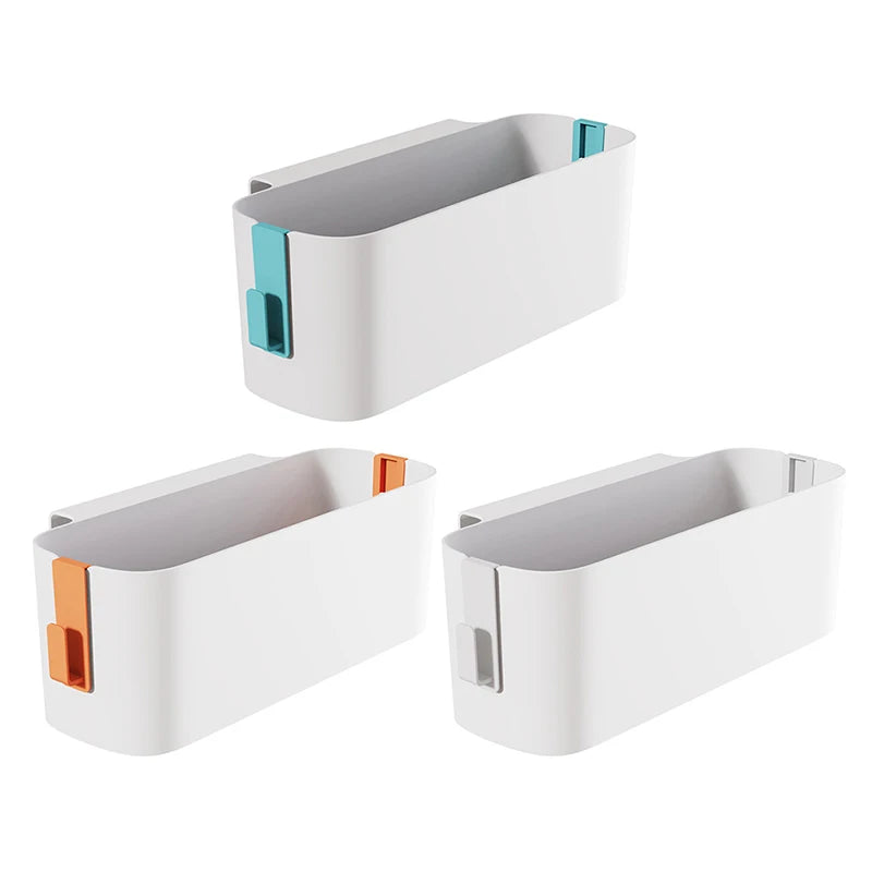 Three bedside hanging storage caddies in white with orange, green, and grey removable hooks