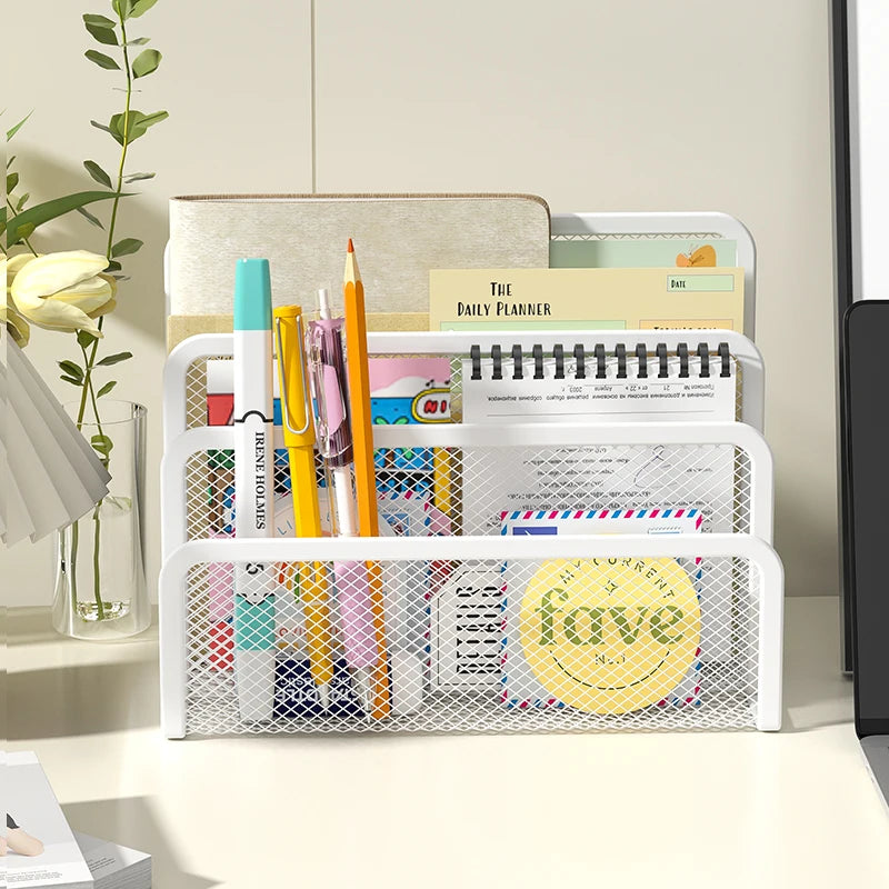 white mesh letter holder on desk, storing pens, markers, notebooks and letters