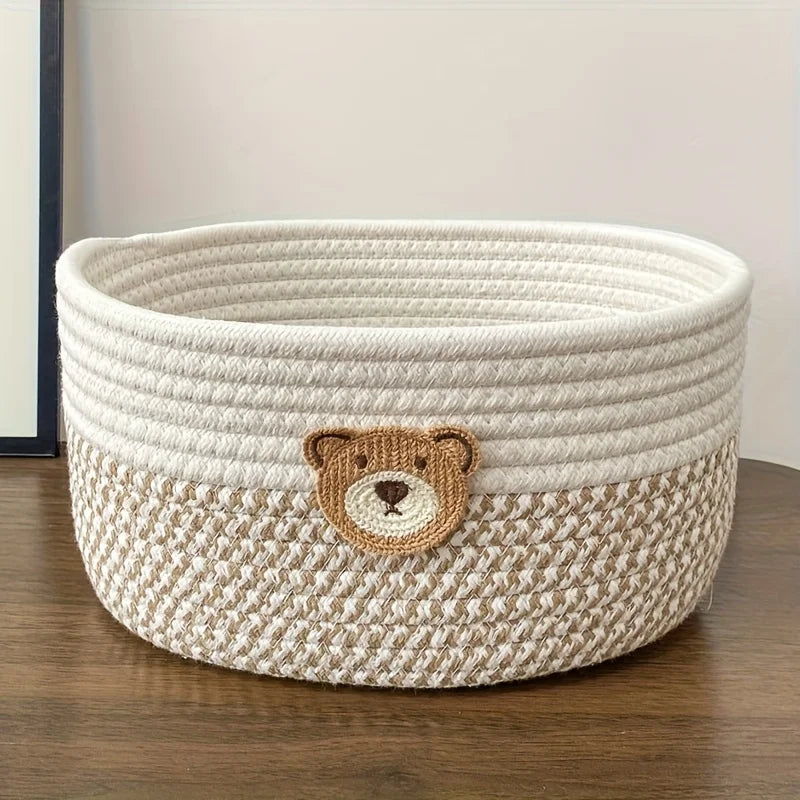 Soft-sided bear patch basket in beige, shown empty on a tabletop