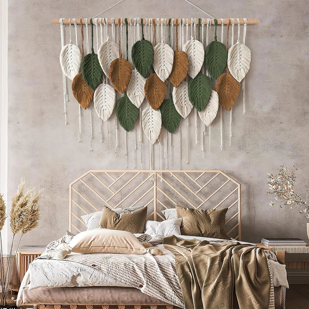 macrame leaf tapestry displayed above a cozy neutral bedding set in a bedroom