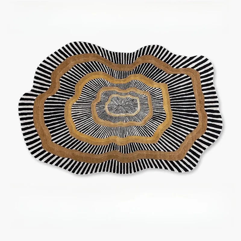 Irregular shape plush area rug with wavy black, white, and brown stripes