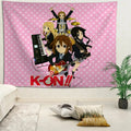 Anime wall tapestry featuring K-ON band characters on pink polka dot background displayed in a bedroom