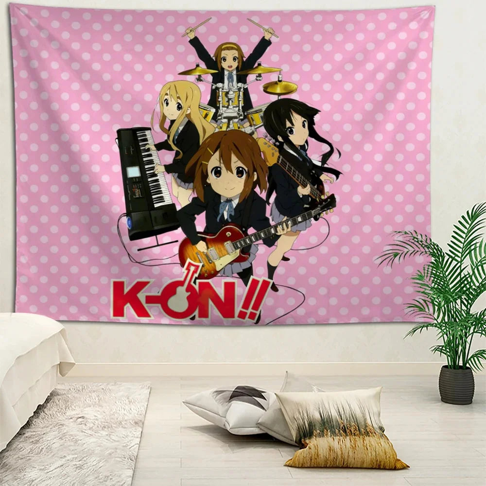 Anime wall tapestry featuring K-ON band characters on pink polka dot background displayed in a bedroom