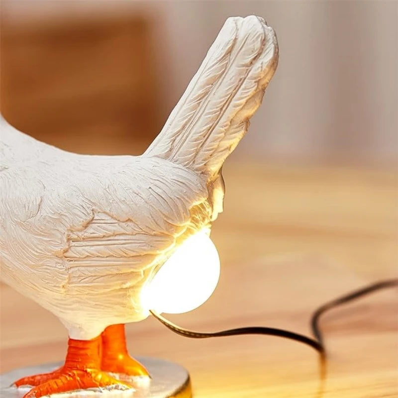 Close-up of chicken figurine night light showing LED bulb on its back