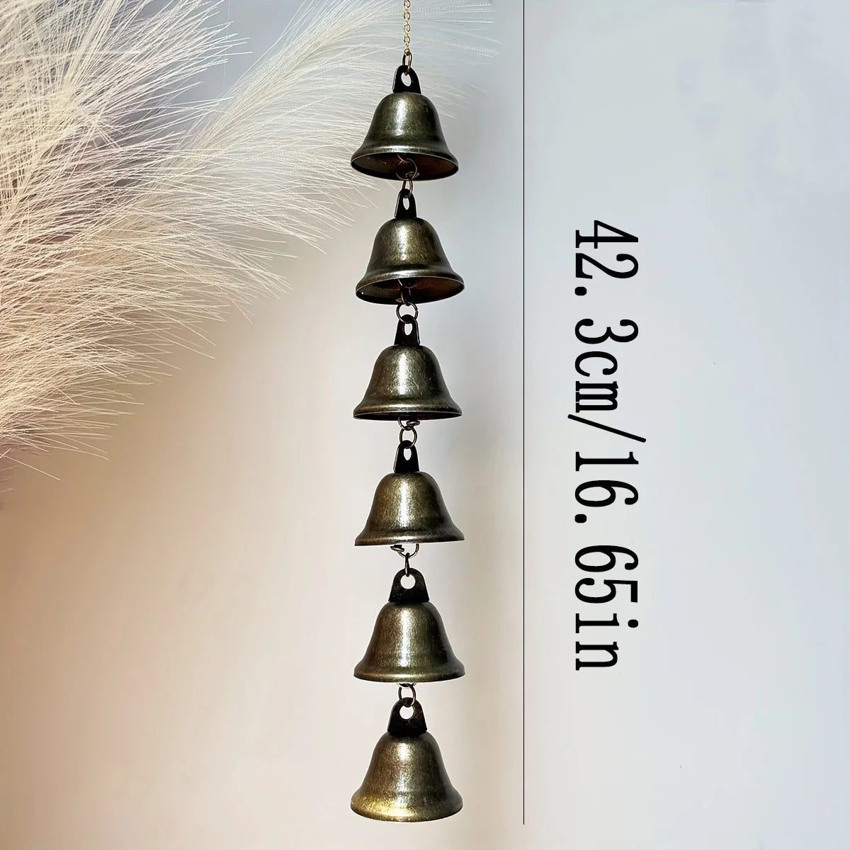 Wind chime with six metal bells, chain, and a measurement of 42.3cm/16.65in displayed