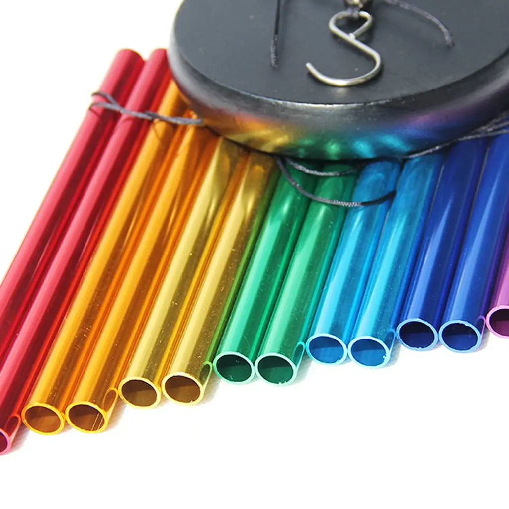 Close-up of colorful wind chime tubes and top hook attachment
