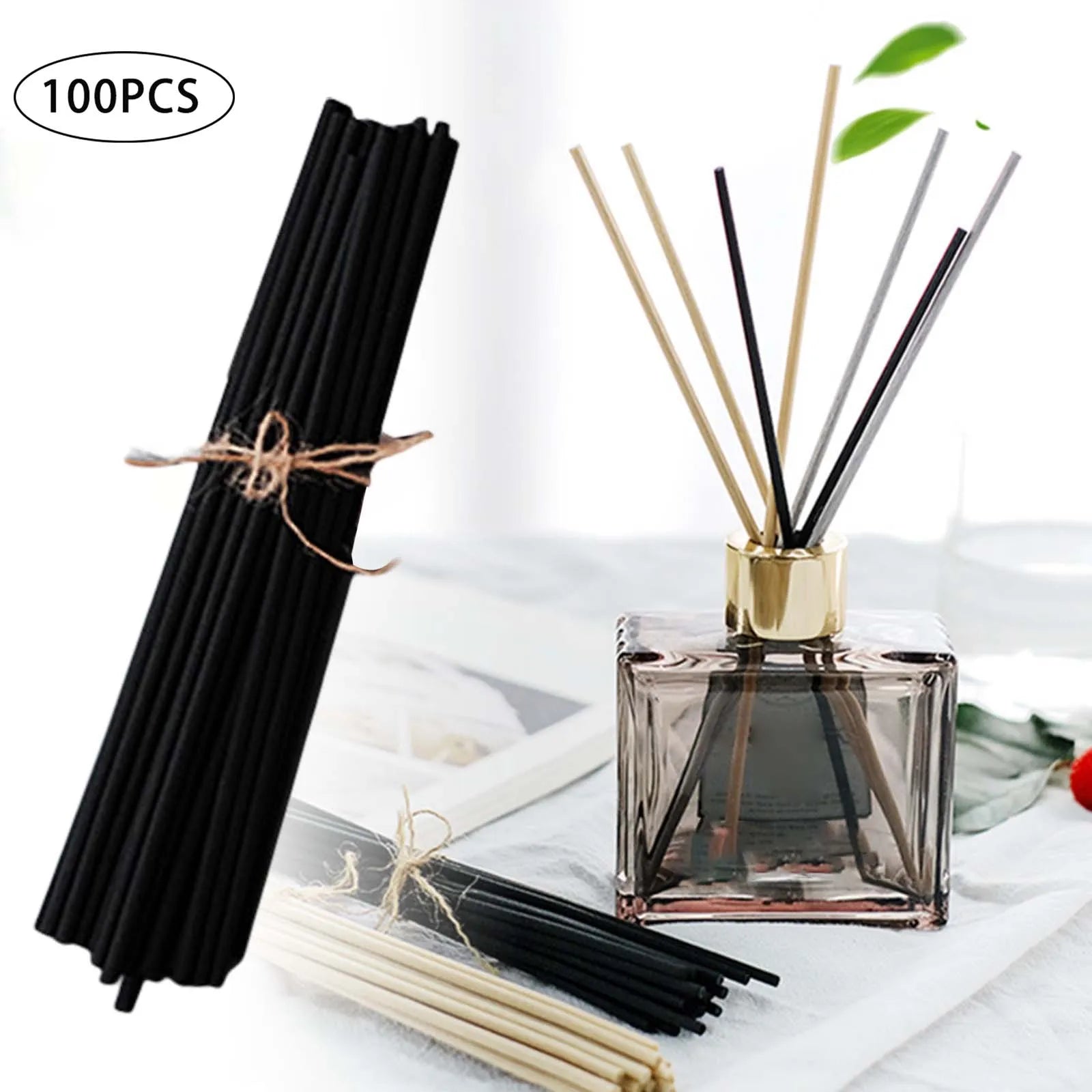 Black reed diffuser sticks bundle and a diffuser bottle setup with mixed color sticks on a table