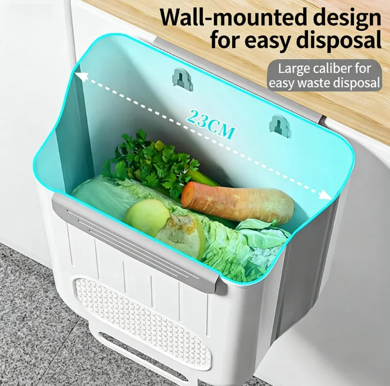 Open wall-mounted trash bin with vegetable peels and food waste inside