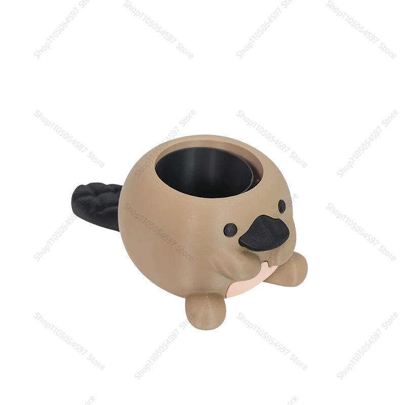 empty platypus-shaped plant pot showing removable insert and smiling face