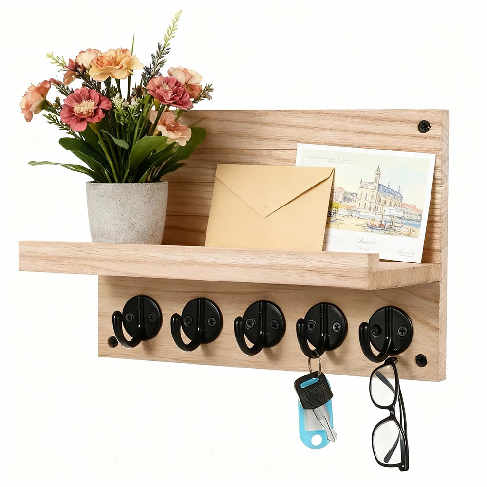 Light wood wall key and mail organizer with shelf, flowers, mail, and everyday keys and glasses stored, entryway background.
