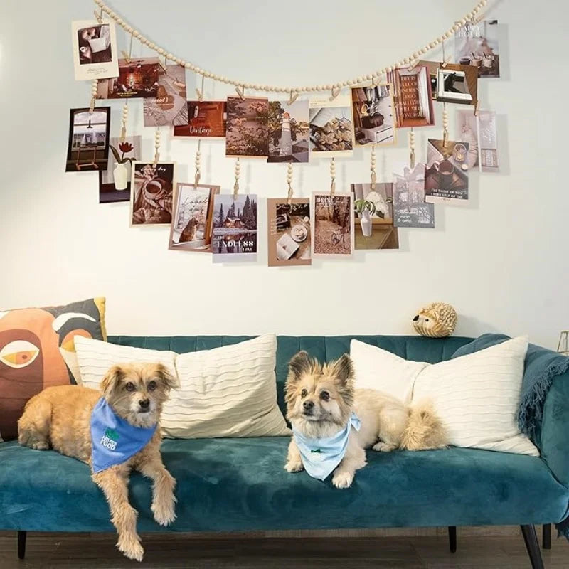 wooden bead garland with photo clips displayed above a sofa in living room