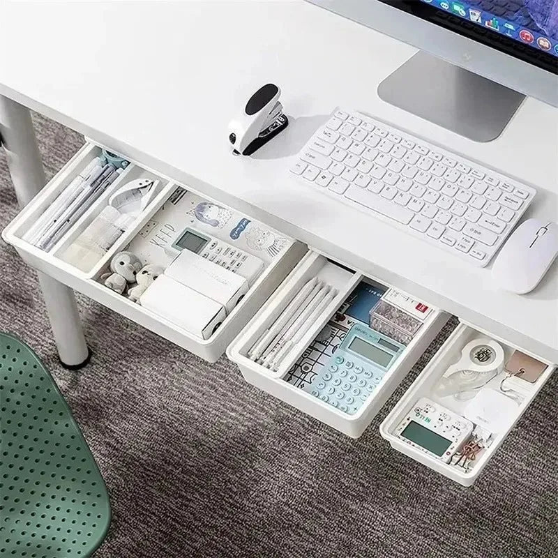 White self-adhesive under-desk storage drawers installed on a modern office desk with office supplies organized inside