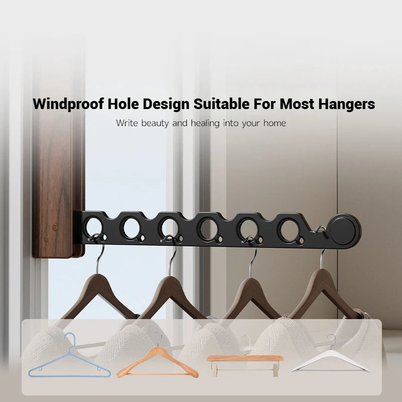 Detail of windproof holes on wall-mounted drying rack with various hanger types