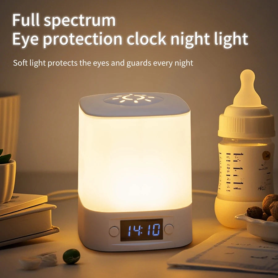 rectangular bedside night light with digital clock display, softly lit on a nightstand beside a bottle and books