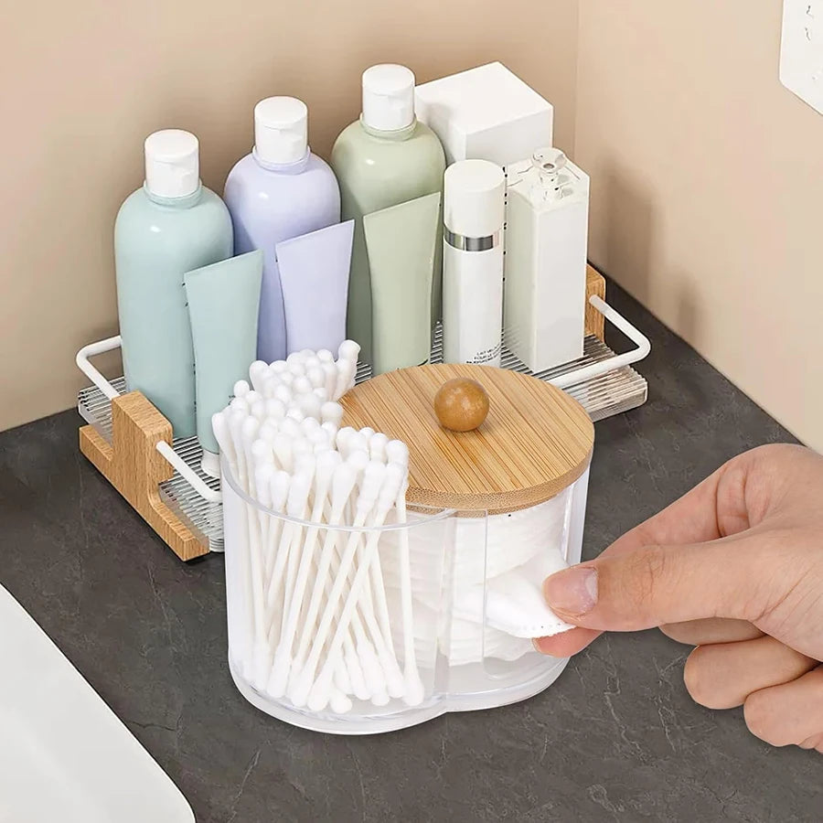 Cotton pad and swab holder in use on bathroom countertop next to toiletries