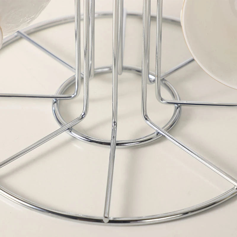 Close-up of the metal base of the mug holder on a white countertop