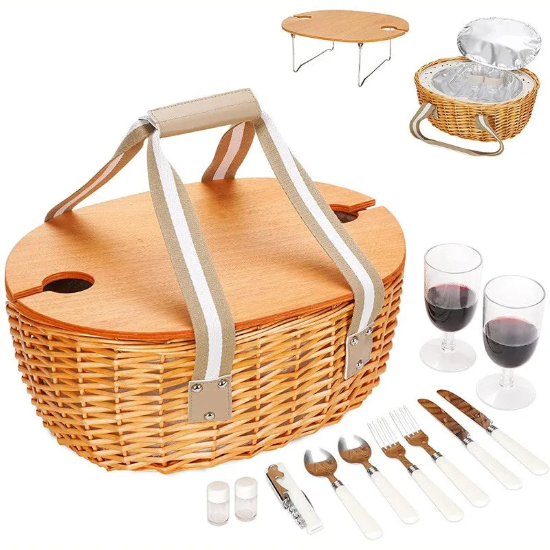 Woven picnic basket with wooden table lid, insulated liner, utensils, and wine glasses arranged for outdoor use