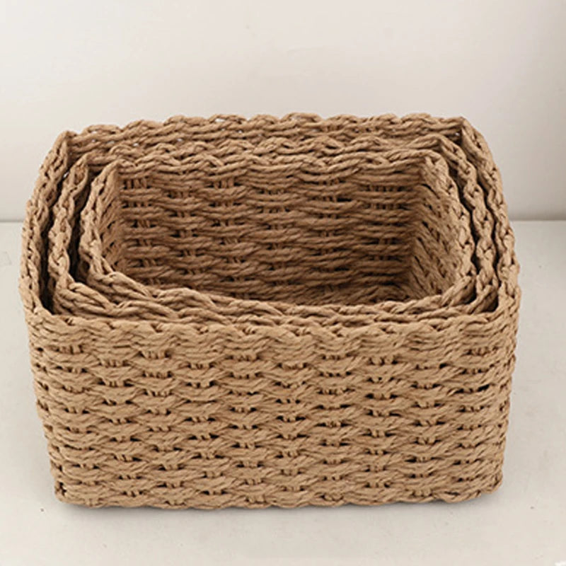 Set of rectangular beige handwoven baskets neatly nested together