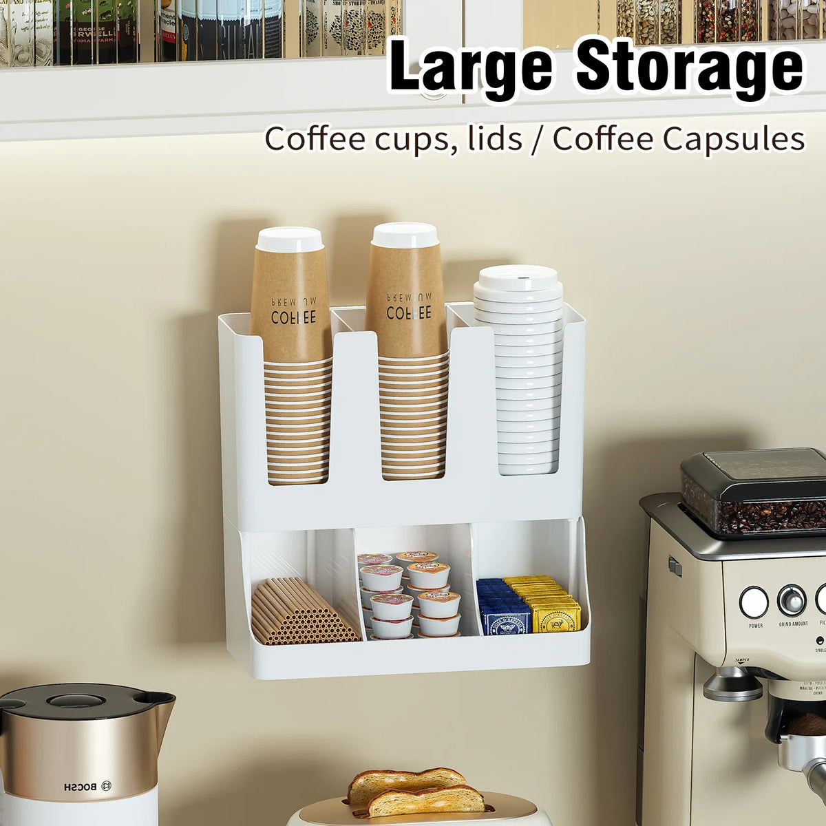 White wall-mounted coffee station organizer with labeled compartments for cups, lids, coffee capsules, and stirrers.