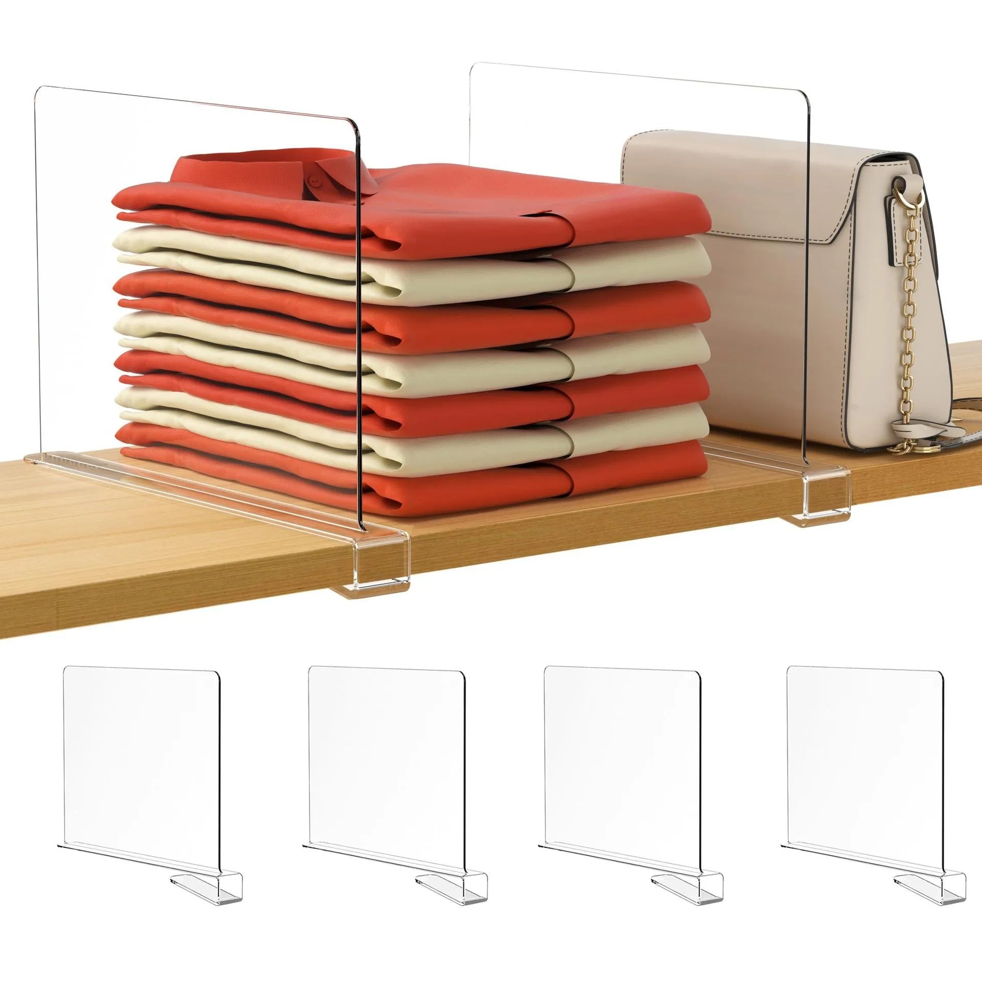 Folded shirts and a handbag separated on a shelf with transparent shelf dividers