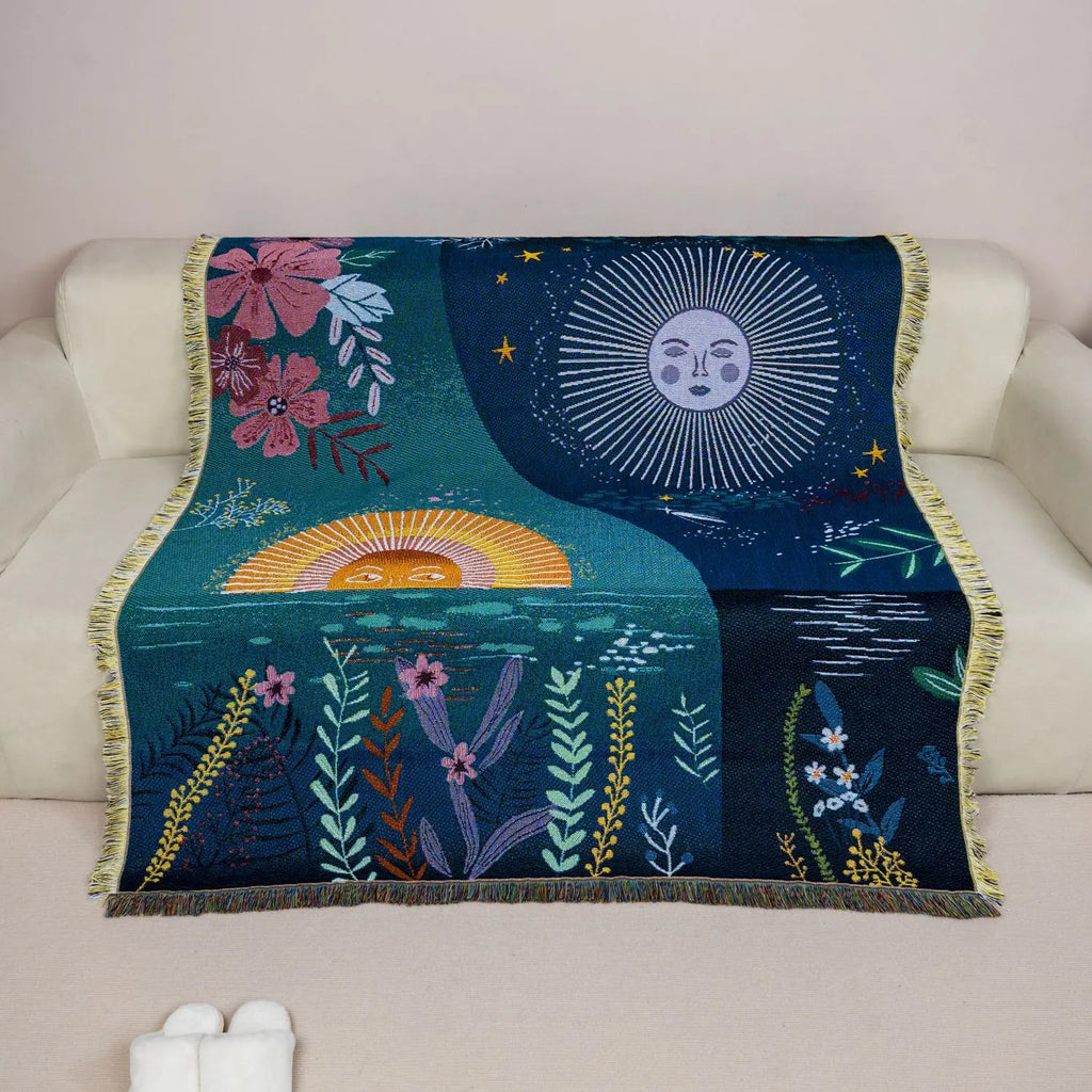 Sun and moon jacquard tapestry draped over a sofa