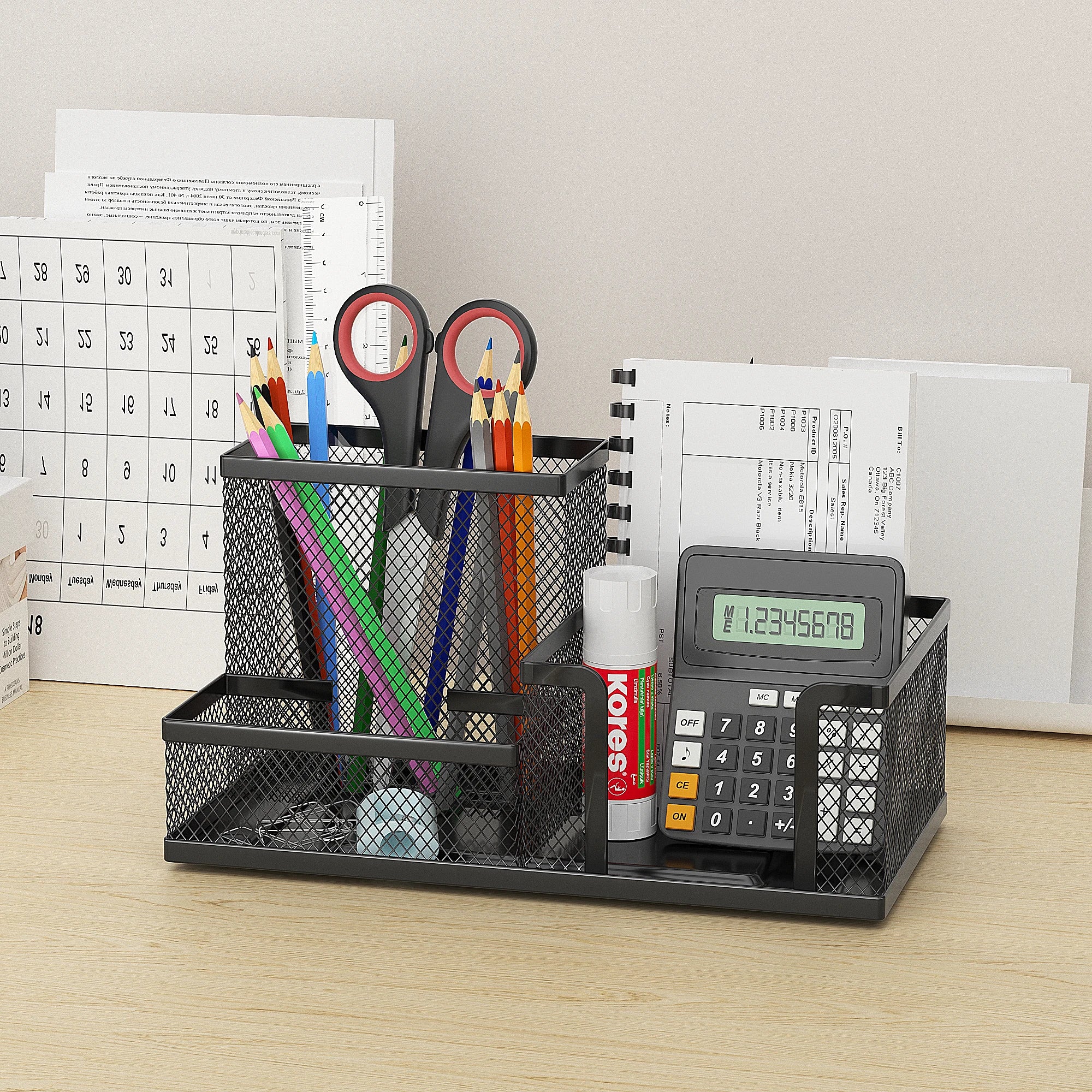mesh metal desk organizer stocked with pencils, scissors, calculator and office supplies