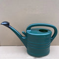 Side profile of green 5L plastic watering can with handle and spout