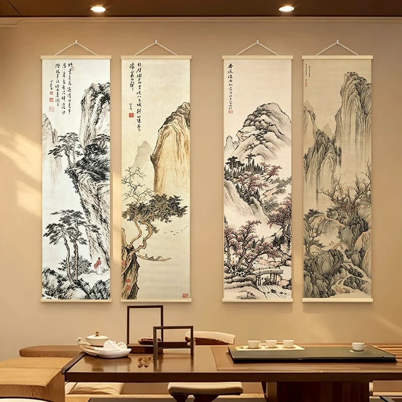 Set of four Japanese ink landscape scroll wall art pieces displayed above a tea table