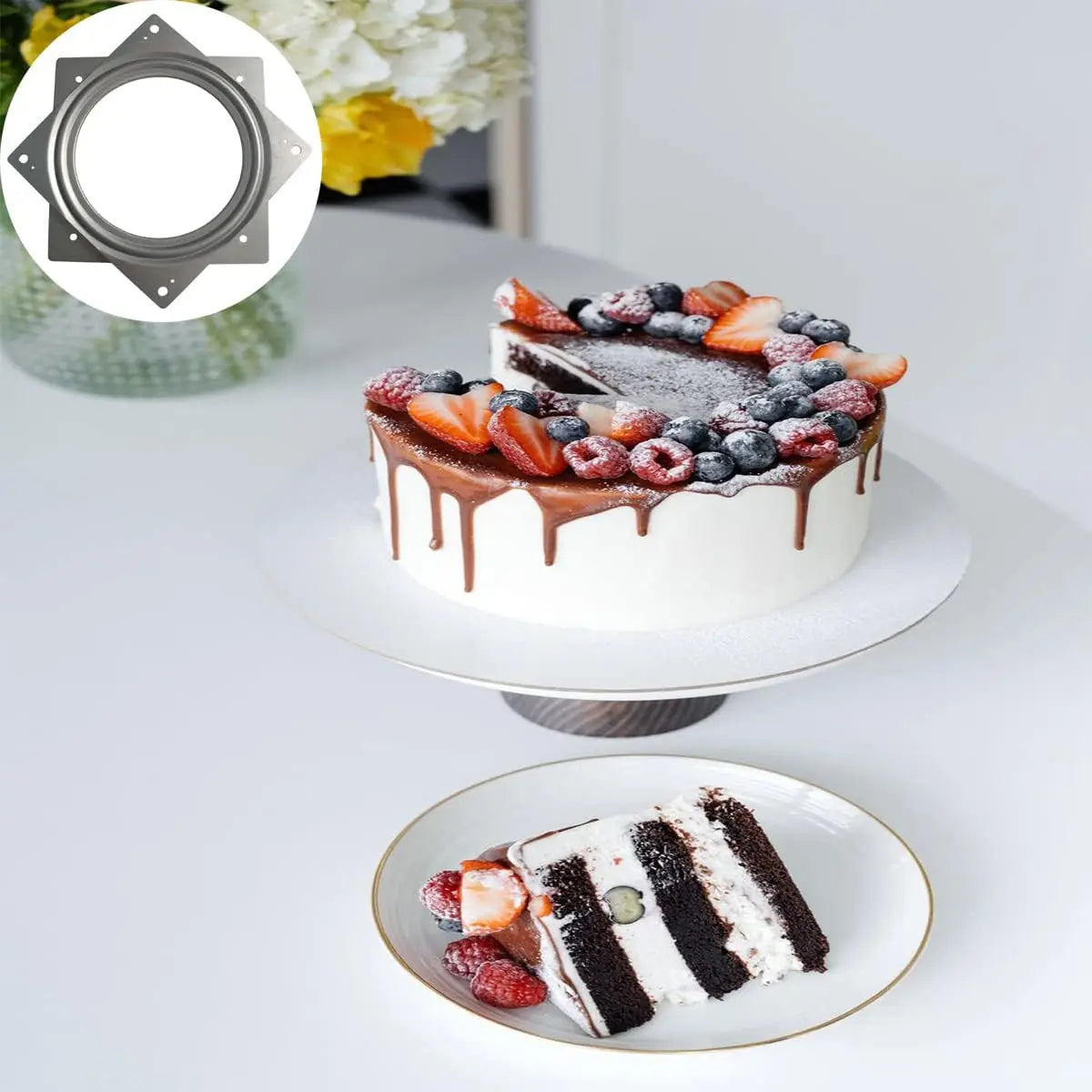 rotating turntable bearing used under a cake stand on a table with a cake and a slice on a plate