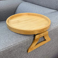 Bamboo clip-on tray table attached to a grey sofa arm showing its sturdy fit