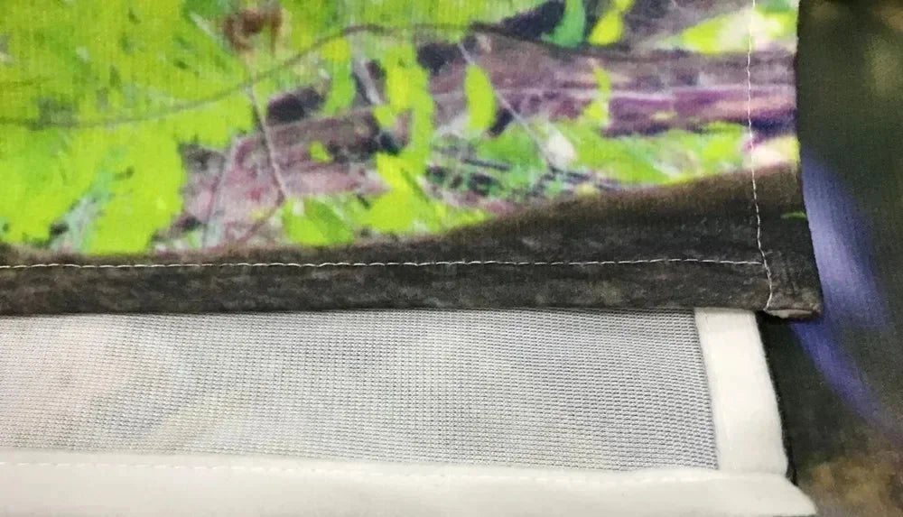 Stitching at the edge of polyester tapestry fabric in close-up