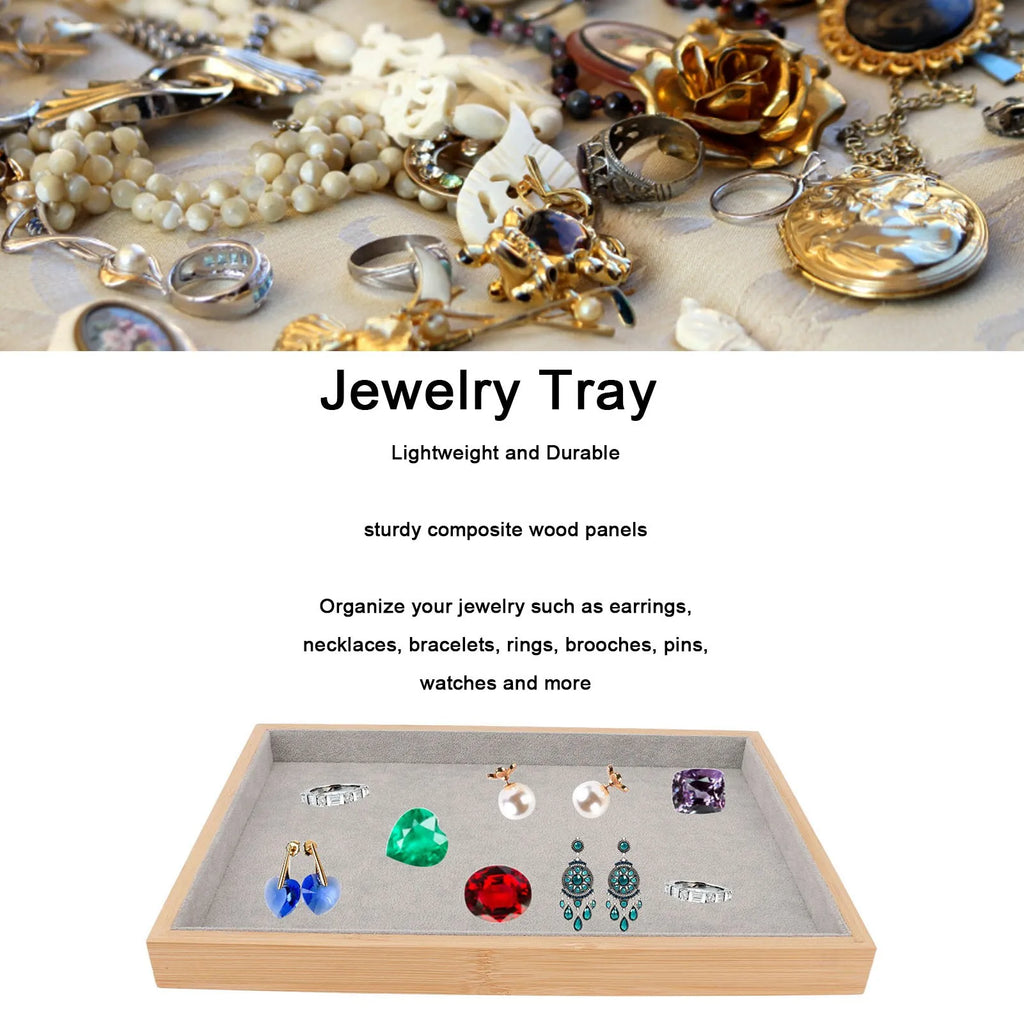 Gray velvet jewelry tray organizing rings, earrings, and costume jewelry