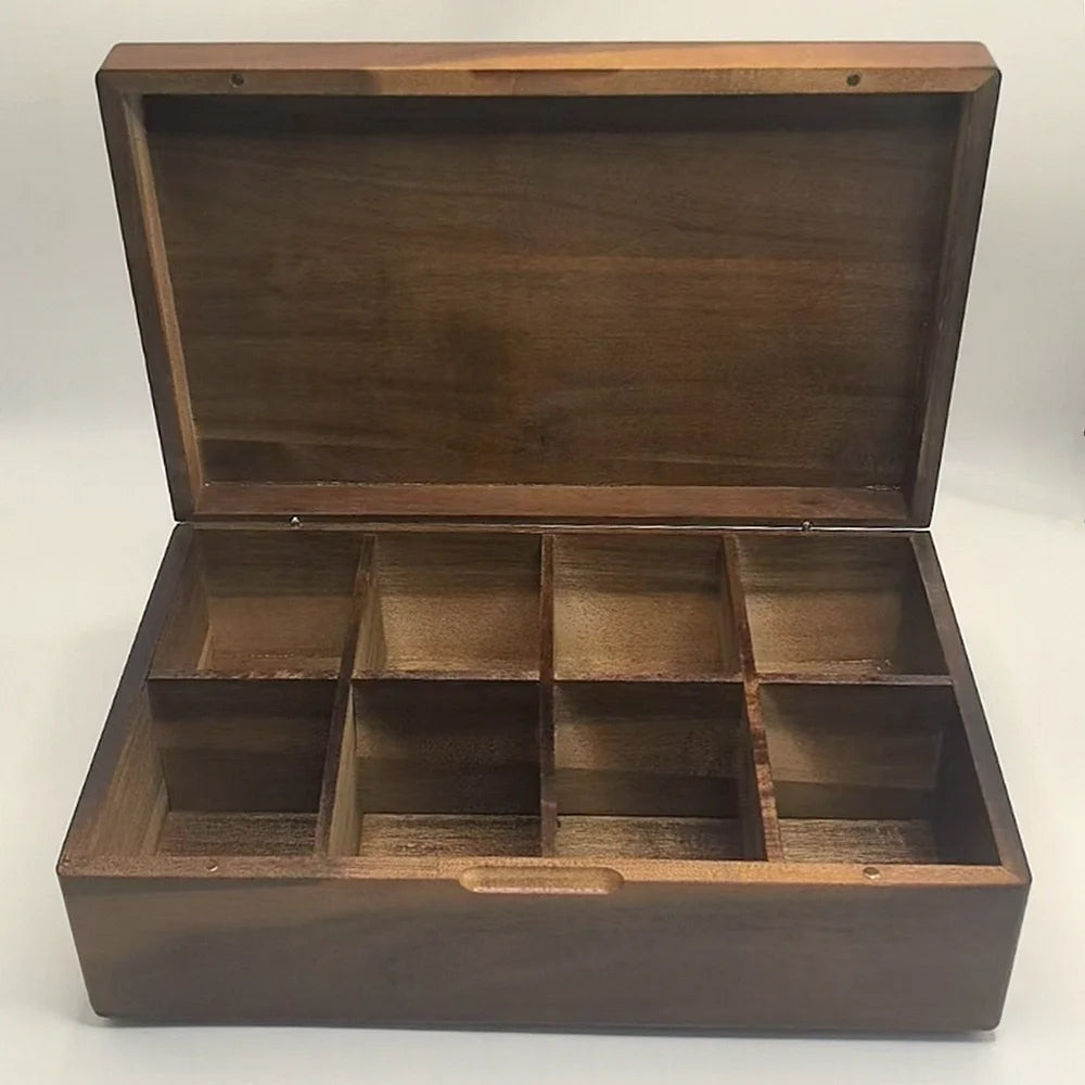 Empty acacia wood tea bag organizer box with 8 compartments, lid open against a plain background
