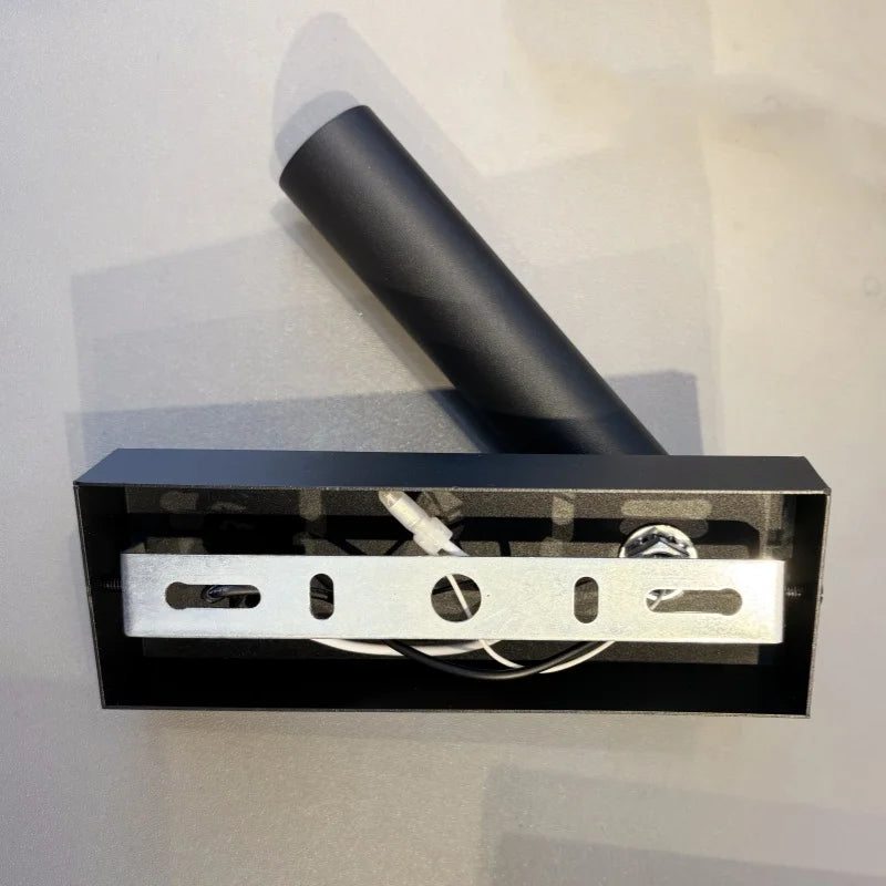 Back view of the wall reading lamp showing mounting hardware and wiring