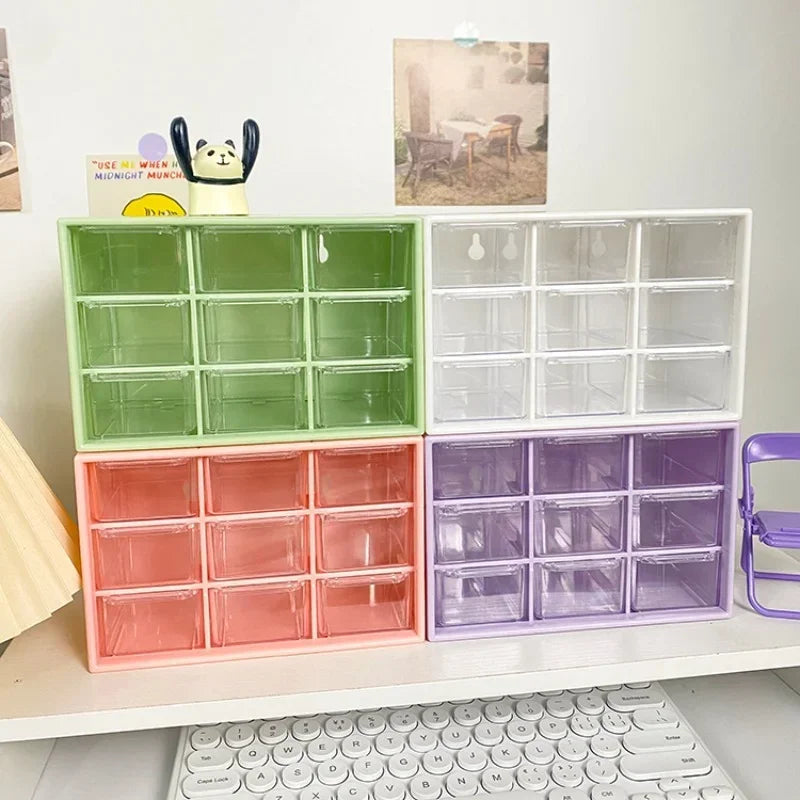 Colorful 9-drawer desktop organizers in green, white, pink, and purple stacked on a desk