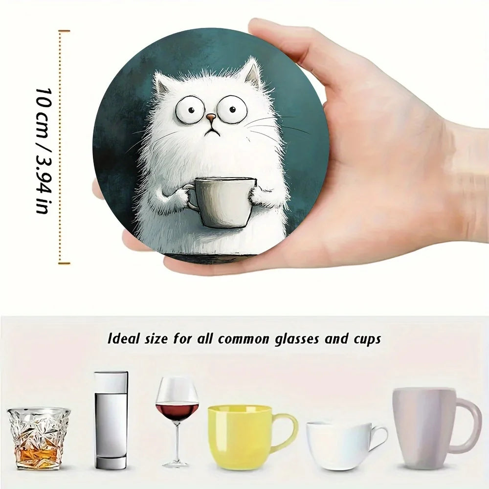 White cat print coaster held in a hand showing 10 cm diameter, alongside glassware and mugs for scale