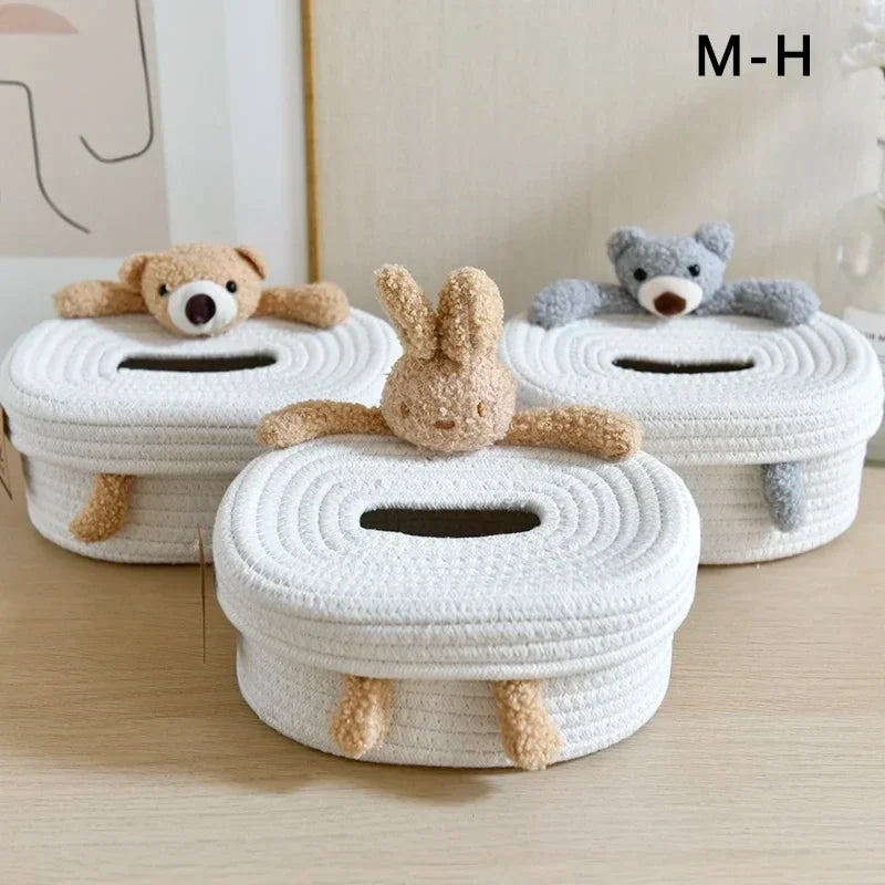 Three Nordic-style plush animal tissue box covers with bear and bunny designs sitting on a tabletop